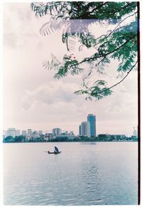 Scenic view of sea and buildings against sky