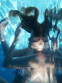 Woman swimming in pool