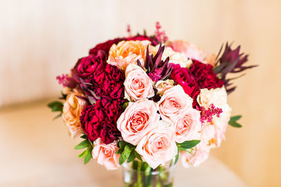 Midsection of woman with bouquet