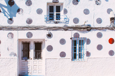 Old house facade painted in polka dots