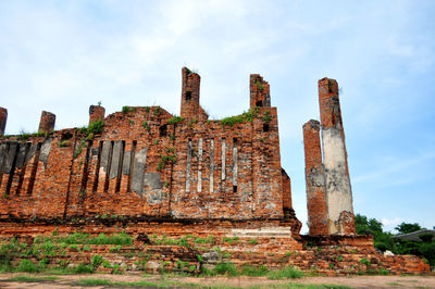 Low angle view of old ruin building against sky