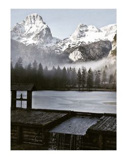 Scenic view of snowcapped mountains and lake against sky