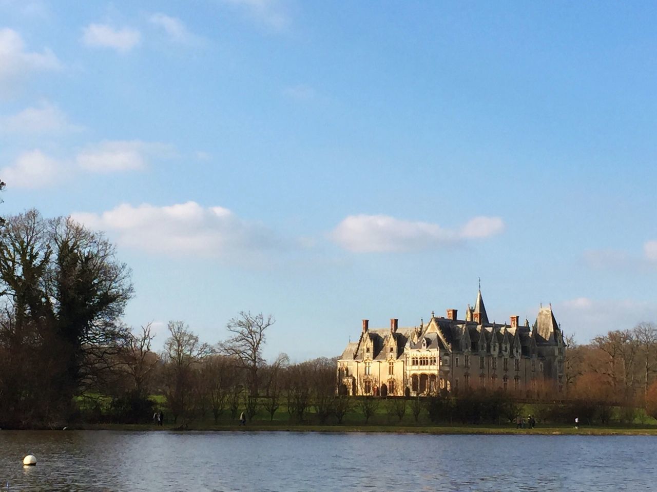 architecture, built structure, building exterior, water, sky, waterfront, tree, river, house, cloud - sky, cloud, lake, day, outdoors, nature, no people, residential structure, blue, residential building, canal