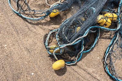 High angle view of fishing net on beach