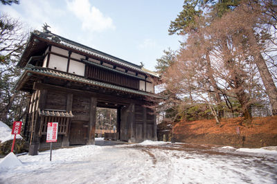 Low angle view of snow covered building