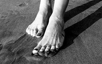 Low section of person on sand