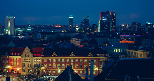 Illuminated buildings in city at night