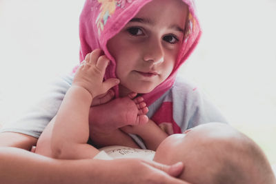 Portrait of cute baby girl at home