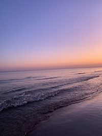 Scenic view of sea against clear sky during sunset