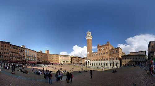 Group of people in front of historical building