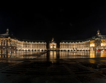 Illuminated buildings in city at night
