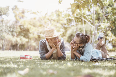 Couple lying on grass