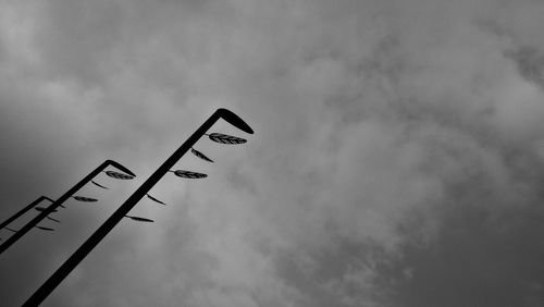 Low angle view of street light against sky