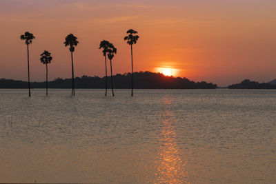 Scenic view of sea against romantic sky at sunset