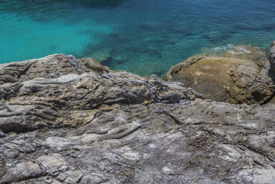 High angle view of rock formation in sea