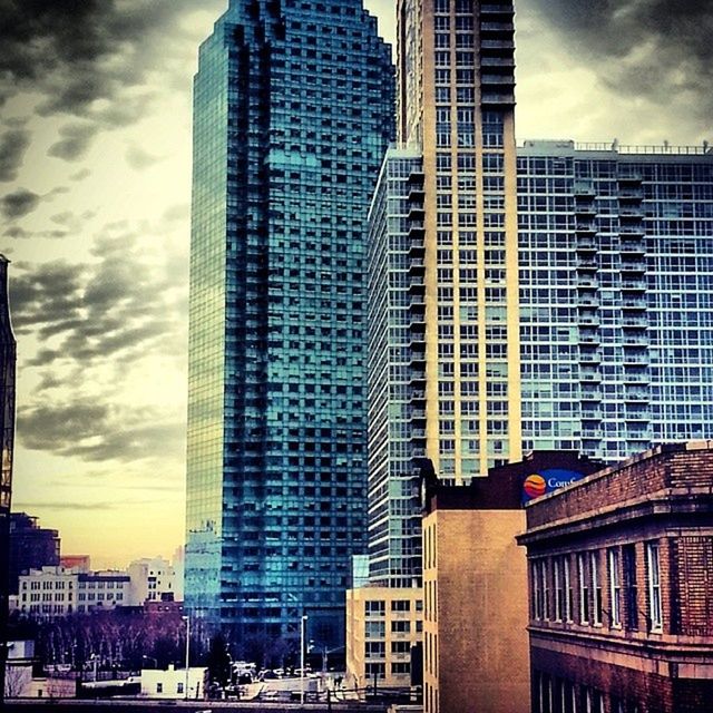 LOW ANGLE VIEW OF BUILDINGS AGAINST SKY