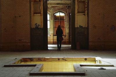 Full length of woman standing in building