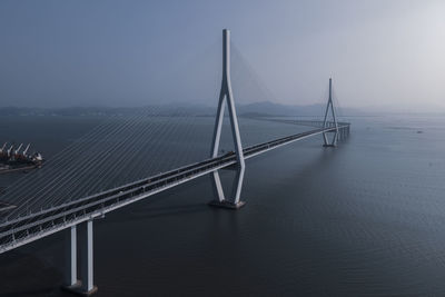 View of suspension bridge over sea