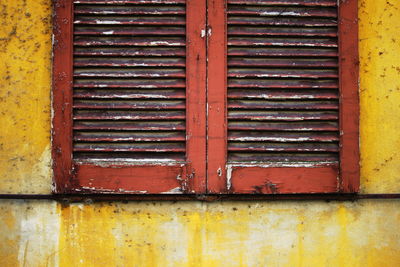 Rusty metal window of old building