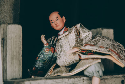 Close-up of young woman sitting outdoors