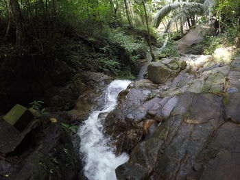 Scenic view of river flowing through rocks