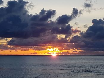 Scenic view of sea against sky at sunset