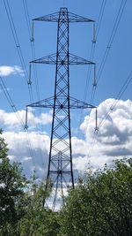 Low angle view of electricity pylon against sky