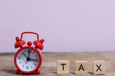 Close-up of clock on table
