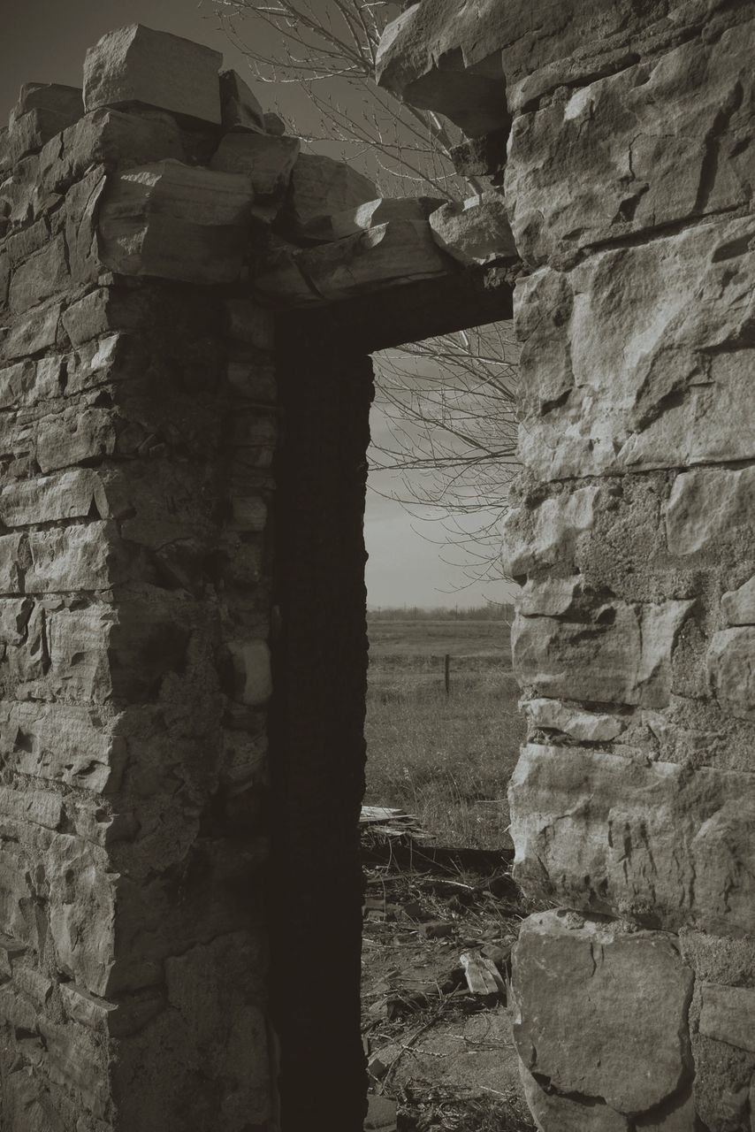 architecture, built structure, stone wall, wall - building feature, old, building exterior, stone material, history, brick wall, wall, old ruin, window, low angle view, weathered, damaged, the past, abandoned, day, no people, rock - object