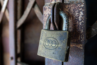 Close-up of padlocks on metal railing