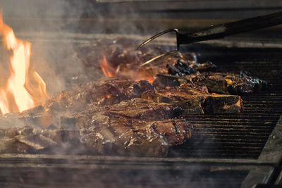 Close-up of meat on barbecue grill in cortona, italy