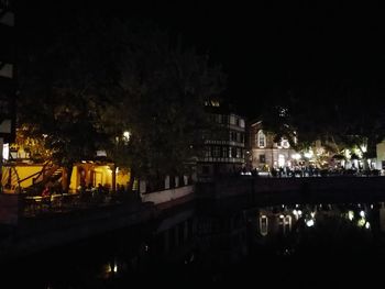 Reflection of illuminated buildings in water at night