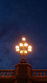 Low angle view of illuminated building against sky