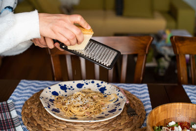 Close-up of person preparing food in restaurant