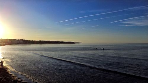 Scenic view of sea against blue sky