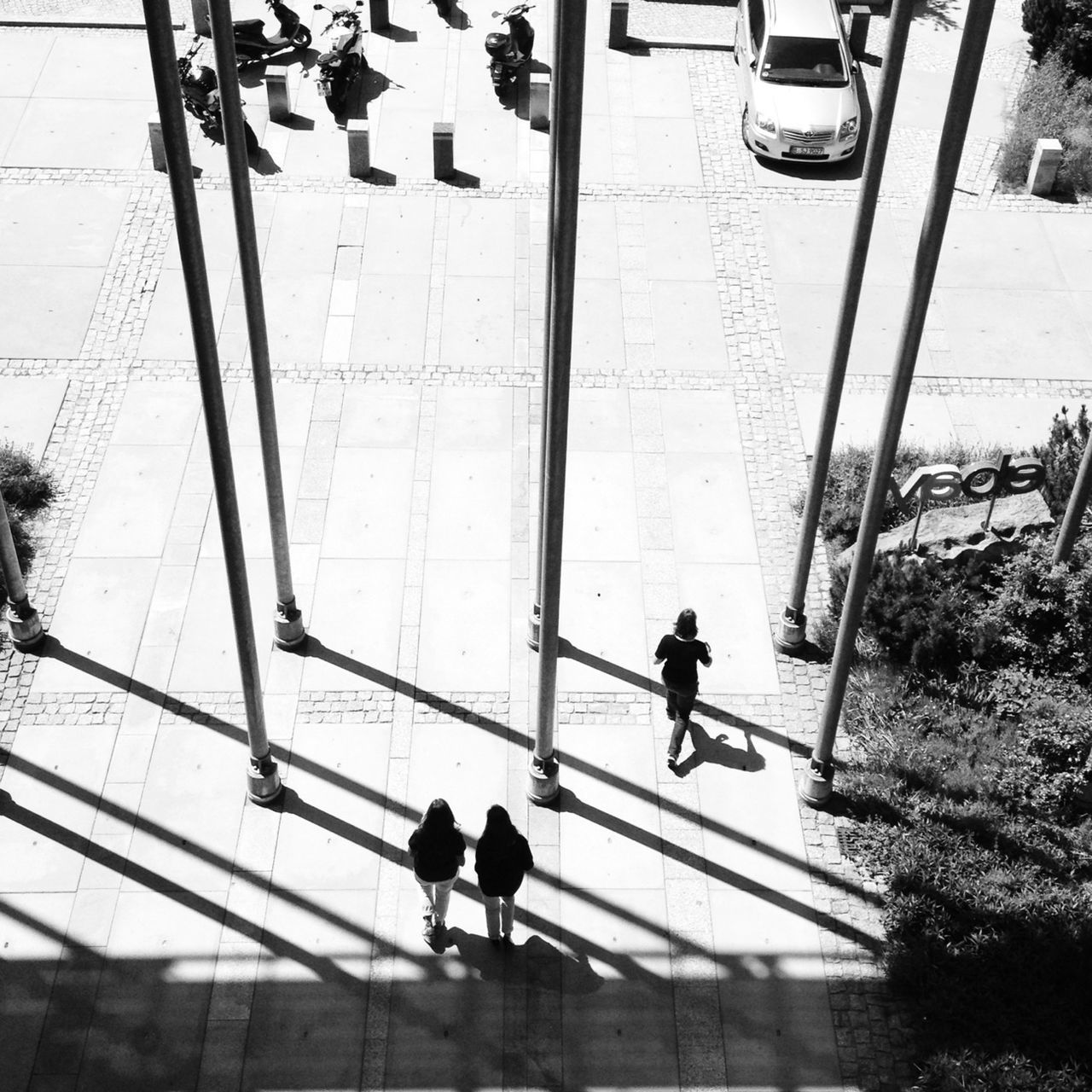 walking, men, architecture, built structure, full length, reflection, lifestyles, person, silhouette, building exterior, city life, rear view, city, indoors, railing, glass - material, high angle view