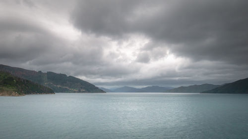 Views on ocean strait during overcast day, ferry heading from north to south island, new zealand