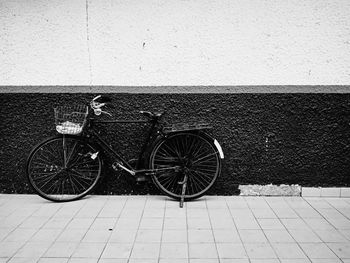 Bicycle parked on wall