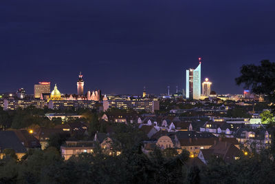 High angle view of illuminated buildings in city at night