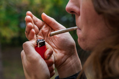 Close-up of woman smoking weed
