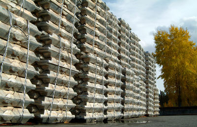 Stack of metal structure against trees