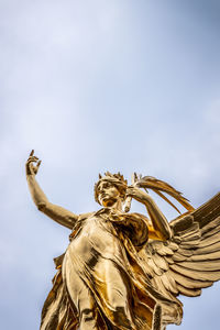 Low angle view of statue against sky