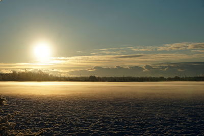 Scenic view of landscape against sky during sunset