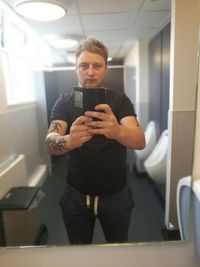 Portrait of young man using smart phone