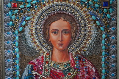 Portrait of woman with multi colored decoration