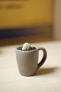 Close-up of coffee cup on table