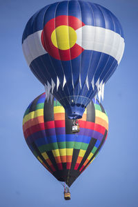 Low angle view of hot air balloons against sky