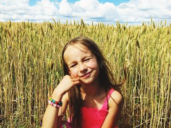 Beautiful young woman in field