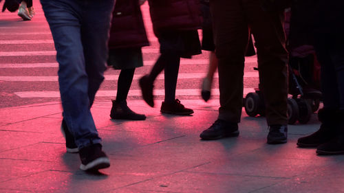 Low section of people on footpath in city