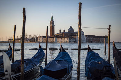 Panoramic view of boats moored in canal